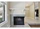 Inviting fireplace with decorative tile and a mantel, creating a cozy focal point in the living space at 116 Morning Glory Dr, Lake Mary, FL 32746