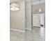 Welcoming foyer with a tiled floor, decorative pendant lighting, and a front door with glass accents at 116 Morning Glory Dr, Lake Mary, FL 32746
