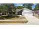 Charming single-Gathering home with well-maintained lawn and attached two-car garage at 116 Morning Glory Dr, Lake Mary, FL 32746