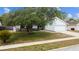 Charming single-Gathering home with mature shade tree in well-maintained front yard at 116 Morning Glory Dr, Lake Mary, FL 32746