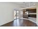 Open living area with hardwood floors leading into kitchen with stainless steel appliances at 116 Morning Glory Dr, Lake Mary, FL 32746