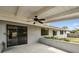 Covered patio with ceiling fan and sliding glass doors at 116 Morning Glory Dr, Lake Mary, FL 32746