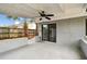 Covered patio featuring a ceiling fan and sliding glass doors to the interior of the home at 116 Morning Glory Dr, Lake Mary, FL 32746