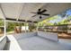 Spacious covered patio with a ceiling fan, overlooking the fenced backyard at 116 Morning Glory Dr, Lake Mary, FL 32746