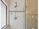 Shower with glass door and window, features tiled walls with tiled border at 116 Morning Glory Dr, Lake Mary, FL 32746