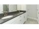 Bathroom featuring a double vanity and plenty of cabinet space at 1328 Lombardi Ct, Poinciana, FL 34759