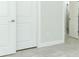 Bedroom featuring double doors with a bathroom at 1328 Lombardi Ct, Poinciana, FL 34759