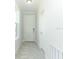 Welcoming hallway with tile floors and white trim around the door and window frames at 1328 Lombardi Ct, Poinciana, FL 34759