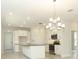 Charming kitchen with white cabinets, a kitchen island, and stainless steel appliances at 1328 Lombardi Ct, Poinciana, FL 34759