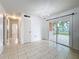 Spacious dining area with sliding doors to the backyard, adjacent to the kitchen for convenient entertaining at 1328 S Oxalis Ave, Orlando, FL 32807
