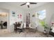 Bright room with a desk and comfortable chair, large window, and ceiling fan at 141 Claire Ln, Davenport, FL 33837