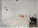 A cozy bedroom featuring a comfortable bed and warm, inviting decor at 141 Claire Ln, Davenport, FL 33837