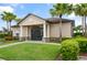Attractive clubhouse featuring stone accents, white pillars, and lush landscaping, enhancing community appeal at 141 Claire Ln, Davenport, FL 33837