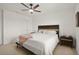 Comfortable bedroom featuring a ceiling fan, bright windows, and stylish decor at 141 Claire Ln, Davenport, FL 33837