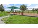 Community playground featuring swings, a slide, benches, and a shaded area, perfect for Gathering fun at 141 Claire Ln, Davenport, FL 33837