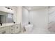 Luxurious bathroom with a freestanding tub, double vanity, and a separate glass-enclosed shower at 15621 Sw 37Th Cir, Ocala, FL 34473