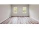 Bright bedroom with hardwood floors and large windows offering natural light at 15621 Sw 37Th Cir, Ocala, FL 34473