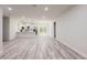 Spacious living area featuring hard wood flooring and an open-concept design connecting to the kitchen at 15621 Sw 37Th Cir, Ocala, FL 34473