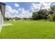 A large backyard offering an abundance of outdoor space and a lush green lawn at 16057 Sw 17Th Ave, Ocala, FL 34473