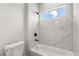 Bathroom with modern tile, shower head, and window at 16057 Sw 17Th Ave, Ocala, FL 34473