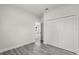 Bright bedroom with gray wood-look floors and a spacious closet at 16057 Sw 17Th Ave, Ocala, FL 34473