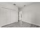 Bright bedroom with gray wood-look floors and a large closet at 16057 Sw 17Th Ave, Ocala, FL 34473