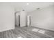 Bright bedroom with gray wood-look floors and a spacious closet at 16057 Sw 17Th Ave, Ocala, FL 34473