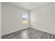 This bedroom features ample natural light and gray wood-look flooring at 16057 Sw 17Th Ave, Ocala, FL 34473