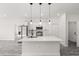 Modern kitchen features stainless steel appliances and a large island with pendant lighting at 16057 Sw 17Th Ave, Ocala, FL 34473