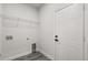 Laundry room features a wire shelf, hookups, and access to the garage at 16057 Sw 17Th Ave, Ocala, FL 34473