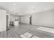 Open floor plan featuring light gray floors, recessed lighting and a modern island kitchen at 16057 Sw 17Th Ave, Ocala, FL 34473