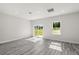 Bright living space with light gray floors, natural light from sliding doors and a large window at 16057 Sw 17Th Ave, Ocala, FL 34473