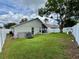 A generous backyard with green lawn and a screened patio, offering space for recreation and outdoor relaxation at 1659 Canton Ln, Oviedo, FL 32765