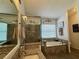 This beautifully tiled bathroom features a large soaking tub and a walk-in shower at 1659 Canton Ln, Oviedo, FL 32765