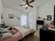A cozy bedroom features a ceiling fan, a closet, and natural light at 1659 Canton Ln, Oviedo, FL 32765