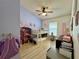 Bright bedroom featuring bunk beds, a ceiling fan, and a large window at 1659 Canton Ln, Oviedo, FL 32765