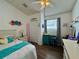 Bright and cheerful bedroom with a ceiling fan and a large window at 1659 Canton Ln, Oviedo, FL 32765