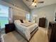 Spacious bedroom featuring wood floors, a ceiling fan, and ensuite bath with shower and tub at 1659 Canton Ln, Oviedo, FL 32765