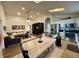 Open-concept kitchen and living space with stainless steel appliances, island, and cozy seating area at 1659 Canton Ln, Oviedo, FL 32765