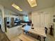 Eat-in kitchen featuring stainless steel appliances, granite countertops, a pantry, and tile flooring at 1659 Canton Ln, Oviedo, FL 32765