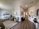 Inviting living area with wood floors, wainscoting, vaulted ceilings, and comfortable seating at 1659 Canton Ln, Oviedo, FL 32765