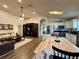 Open-concept living area with high ceilings, skylights, and a large sliding barn door entertainment center at 1659 Canton Ln, Oviedo, FL 32765