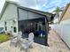 A cozy screened patio with brick pavers offers a relaxing outdoor living space with views of the fenced backyard at 1659 Canton Ln, Oviedo, FL 32765