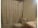 Cozy bathroom with standard bathtub, toilet, and vanity at 233 N Hudson St, Orlando, FL 32835