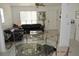 Cozy living room featuring tile flooring, comfortable furniture, a ceiling fan, and bright, natural light at 233 N Hudson St, Orlando, FL 32835