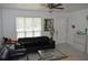 Bright living room featuring tile flooring, modern furniture, neutral walls and ample natural light at 233 N Hudson St, Orlando, FL 32835