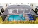 Screened in pool with integrated spa and patio at 2850 Bookmark Dr, Kissimmee, FL 34746