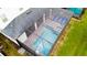 Aerial view of the screened in pool and spa at 2850 Bookmark Dr, Kissimmee, FL 34746
