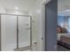 Bright bathroom featuring a glass-enclosed shower and tile surround at 2850 Bookmark Dr, Kissimmee, FL 34746