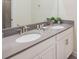 Bright bathroom featuring double sinks, gray quartz countertops, and a large mirror, creating an inviting space at 2850 Bookmark Dr, Kissimmee, FL 34746